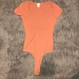 Orange body suit